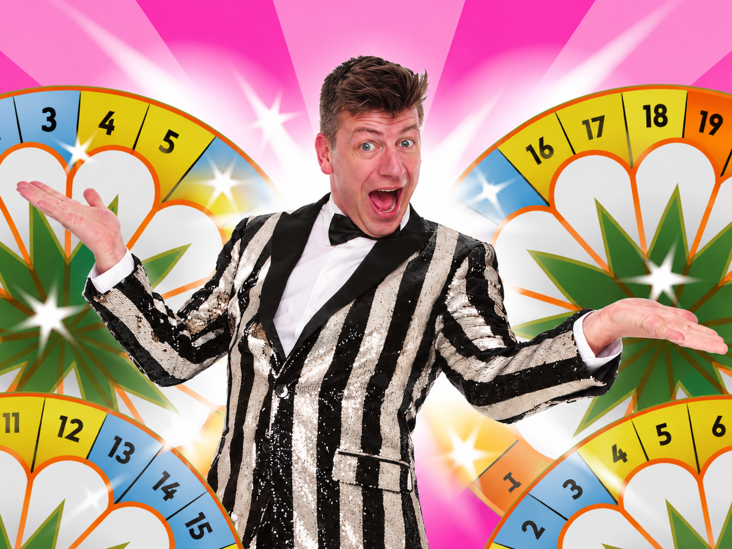 Rasmus Skovmand in a striped jacket with arms outstretched against the colorful Lykkehjulet wheel.